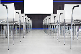  Chairs lined up in front of a projection screen